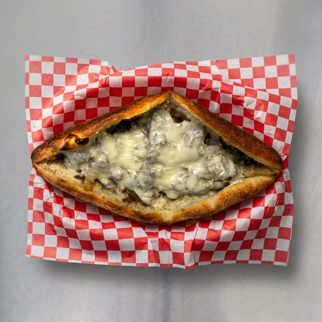 Chicken or Cheesesteak Pizzaiola Sandwich.